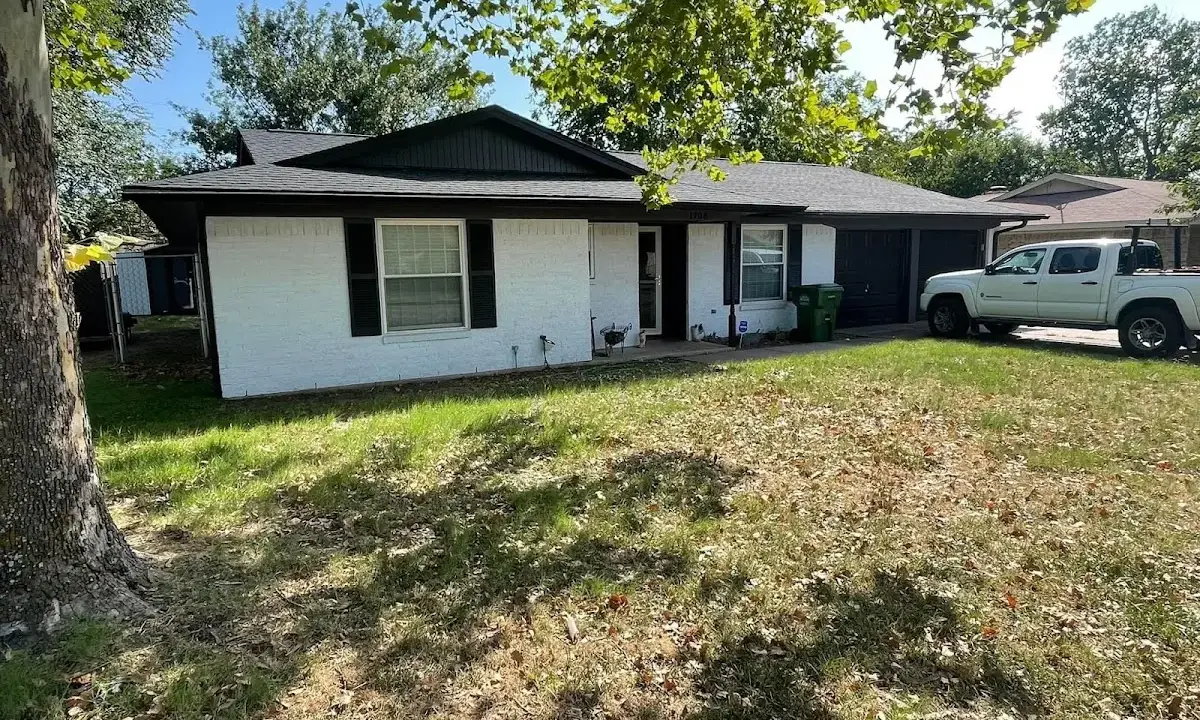 Professional roofing crew working on a residential roof in San Antonio